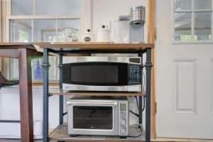 Closeup of microwave and toaster oven in an Airbnb listing.