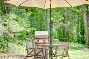 Photo of an outdoor grill and seating area of an Airbnb in the Catskills.