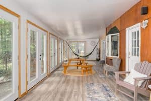 Photo of the entrance and sun-porch of an Airbnb in the Catskills.